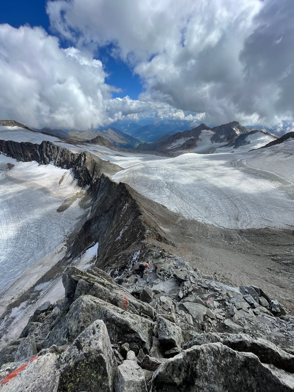 steep mountain ridge with climbers