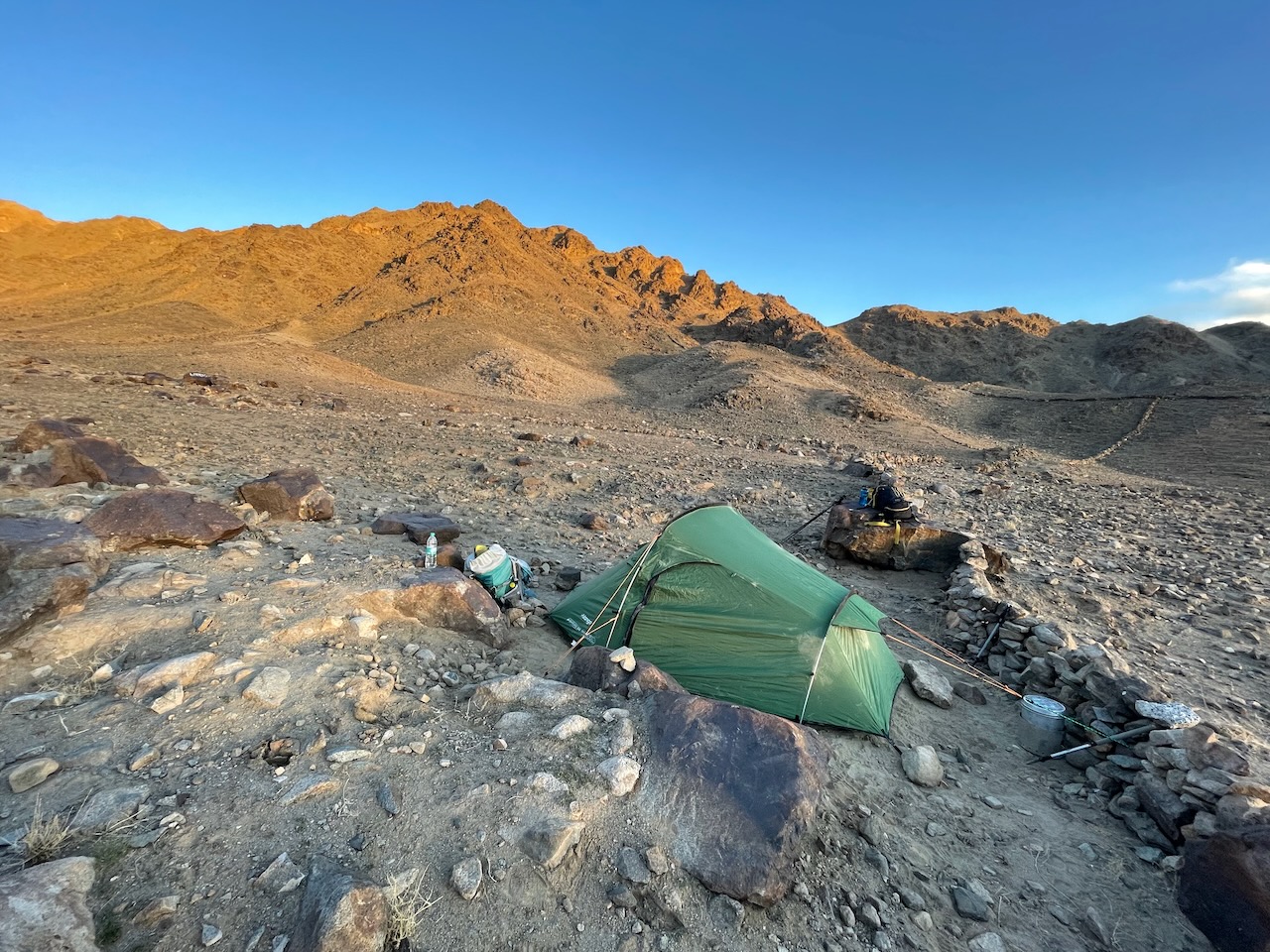 tent in a rocky mountain landscape